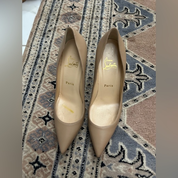 Christian Louboutin pumps.